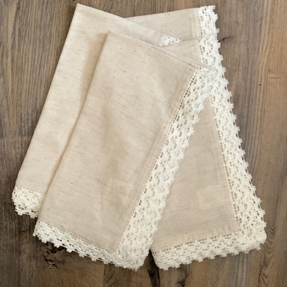 Pier 1 tan with white lace cloth napkins. 6 available.